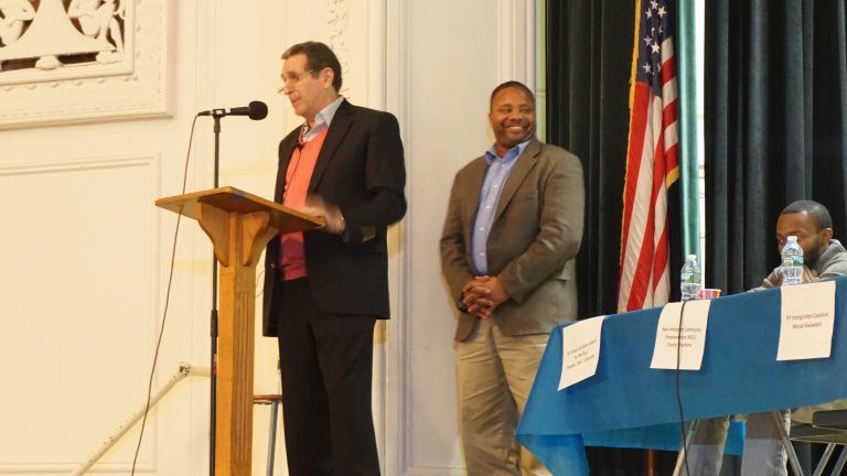 Senator Jesse Hamilton is introduced by moderator Norman Siegel, a prominent civil rights lawyer