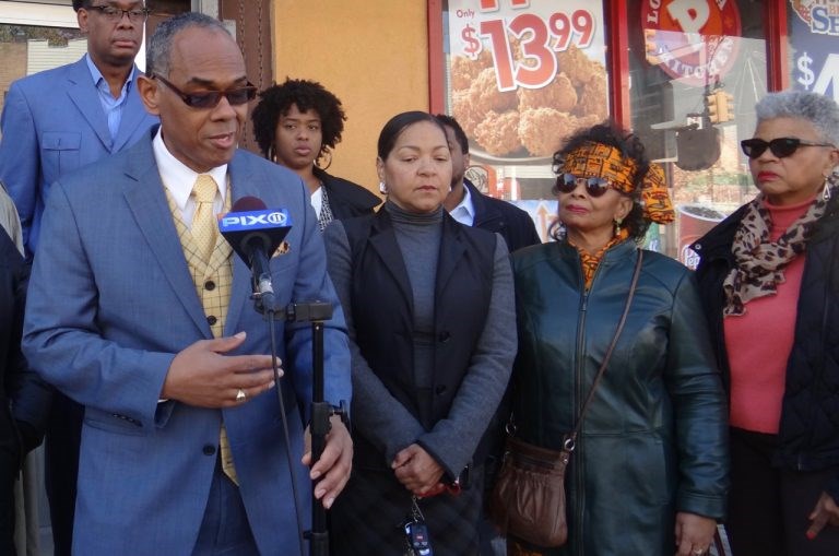 (far left) Richard Flateau and his partner Gloria Sandiford (to his left) speak at a press conference concerning a property the two owned that was almost taken as a result of deed fraud.