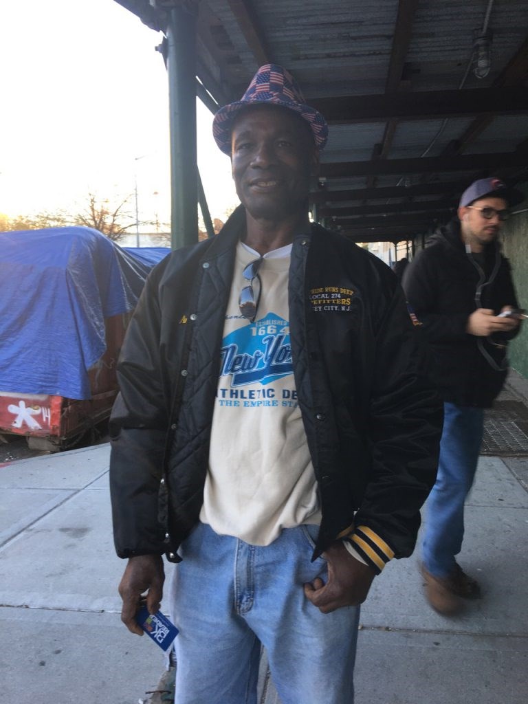 Antony leaves the poll, wearing his flag donning American flags: "I saw how the market cleared up last week when all of that FBI information came out about Hillary. Hillary's gonna get this! I'm feeling good, I'm feeling real good."