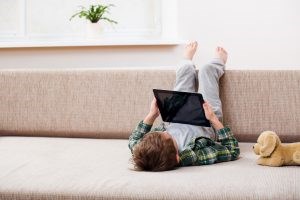 young-boy-playing-with-tablet-300x200