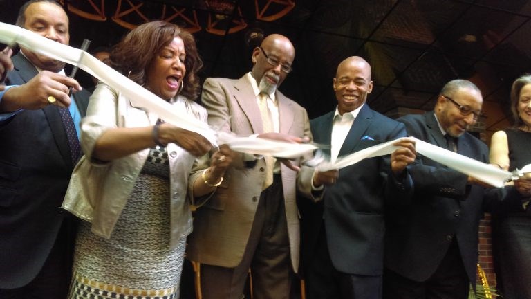 Former City Councilmember Al Vann leads the ribbon-cutting of the re-opening of the Billie Holiday Theatre