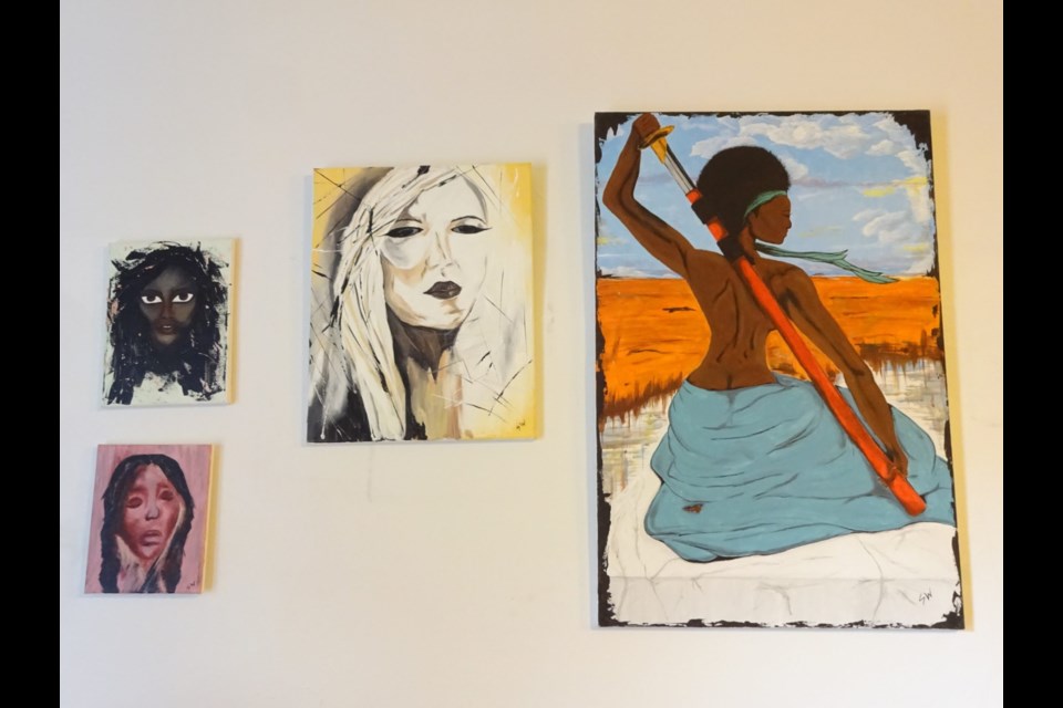 Portraits by Shavon Wilkins greet you as you enter the gallery space.