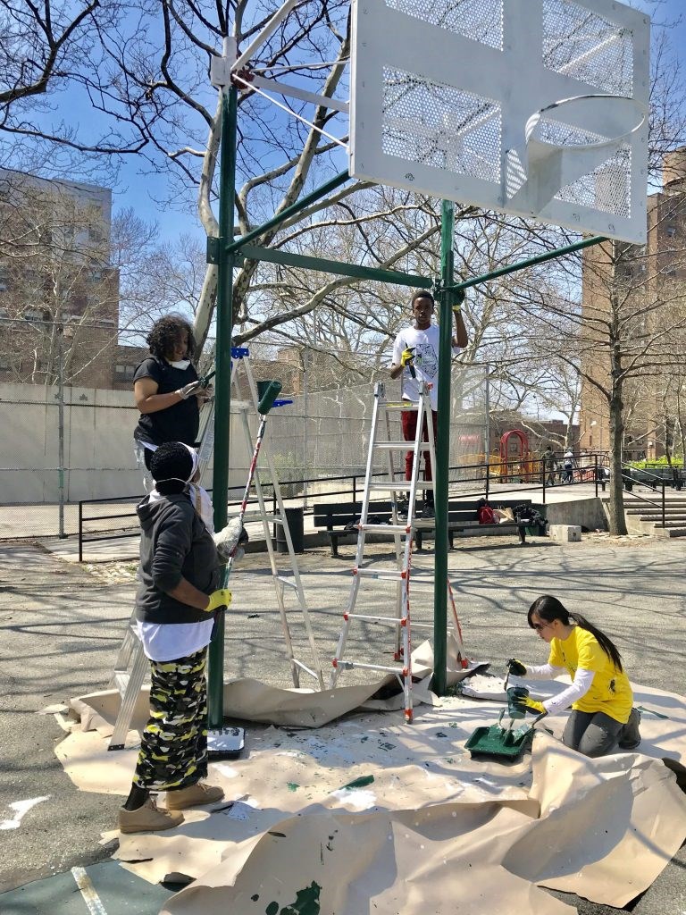 Volunteers repainted basketball hoops and boards at Van Dyke Park