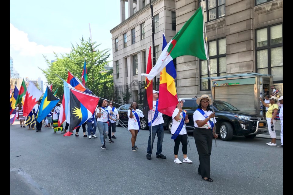Brooklynites from more than 80 countries carrying the flags of 195 nations marched down Fulton Street toward Brooklyn Borough Hall.