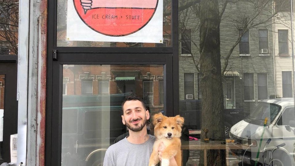 Eric Kyriakopoulos and his main paw-pal Simon in front of the soon-to be open Ollie's Ice Cream & Stuff.