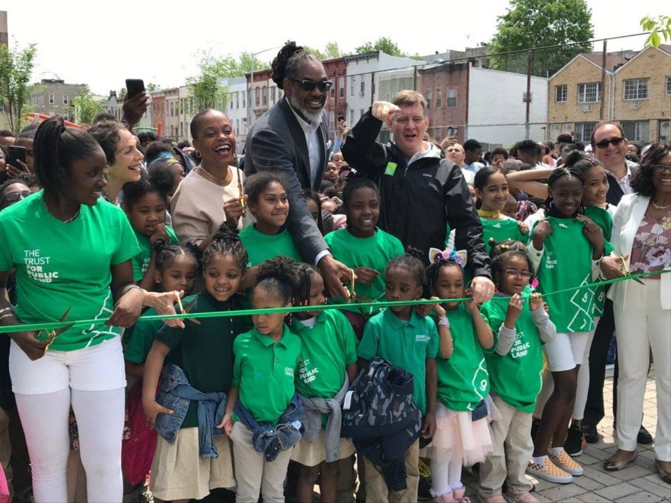 Assemblywoman Tremaine Wright, Councilman Robert Cornegy, and Carter Strickland of the Trust for Public Land cut the ribbon at the opening ceremony