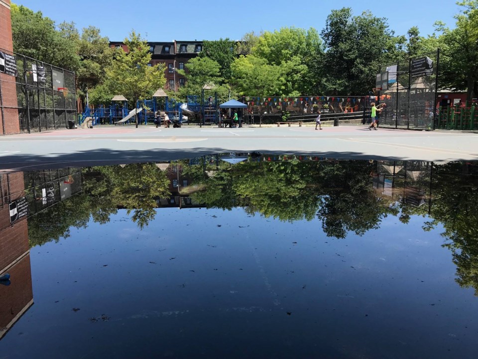 Water engulfing Clinton Hill basketball court