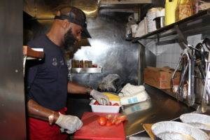 Brooklyn Moon owner Michael Thompson at work in the kitchen. Photo: Anna Bradley-Smith