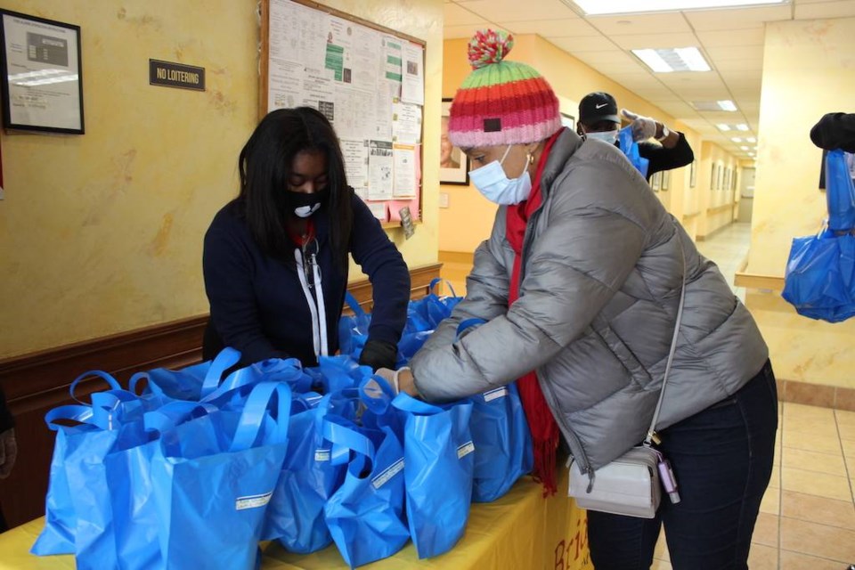 Assemblywoman Tremaine Wright hands out soup at Quincy Senior Residences. Photo: Anna Bradley-Smith.