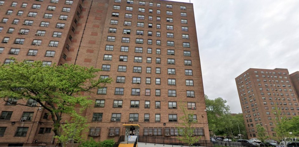 Residents line outside of The Van Dyke Housing Complex in Brownsville, Brooklyn