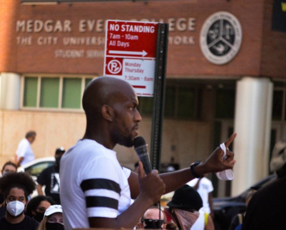 Jamall Henderson Speaking in front of Medgar Evers College