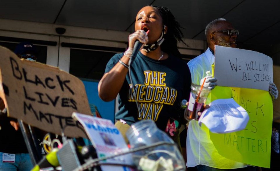 Sakia Fletcher rallies in with protesters in front of Medgar Evers College