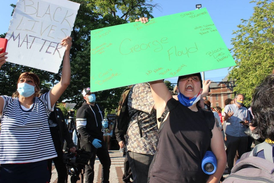 Kayla Vargas leads the crowd yelling "say his name". Photo: Anna Bradley-Smith for BK Reader.