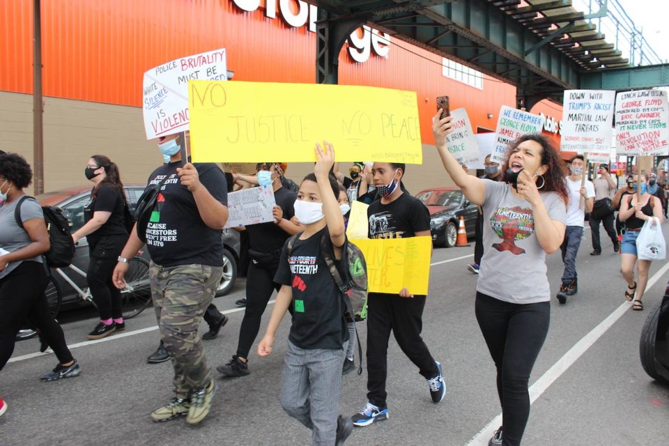 Friends Brooklyn coordinator Venus Core took to the streets to protest brutality with her kids. Photo: Anna Bradley-Smith for BK Reader.