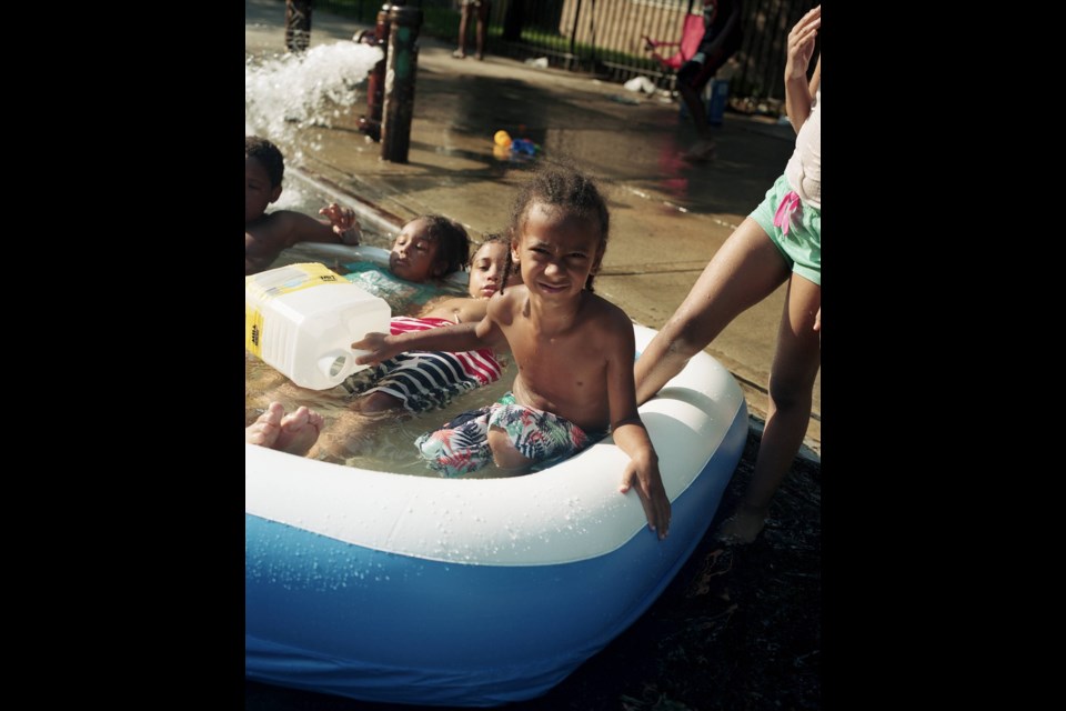 Brooklyn residents cool off on the streets. Photo: Mateo Ruiz Gonzalez for BK Reader.