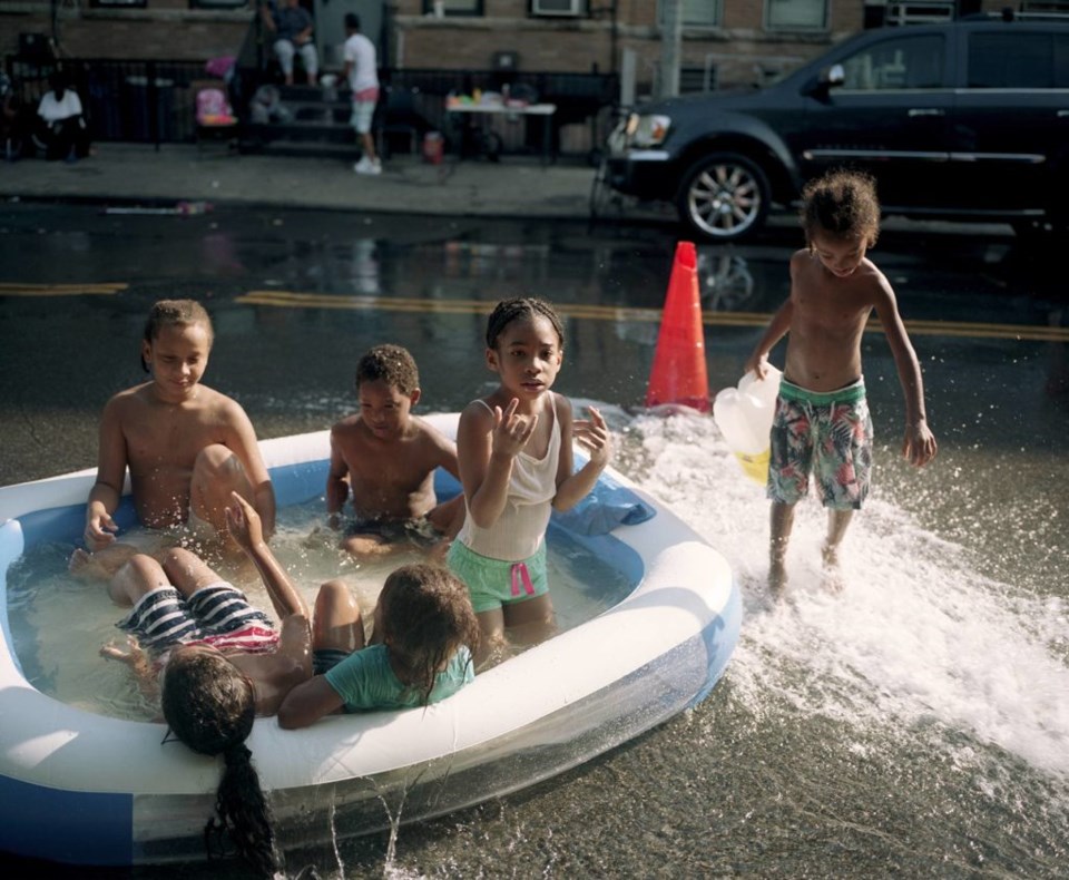 Brooklyn residents cool off on the streets. Photo: Mateo Ruiz Gonzalez for BK Reader.