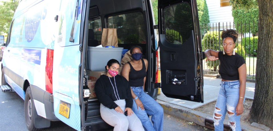 Denise Rodriguez, Shabieko Ivy and Sevonna Brown with the fully loaded Sistas Van. Photo Mateo Ruiz Gonzalez for BK Reader.