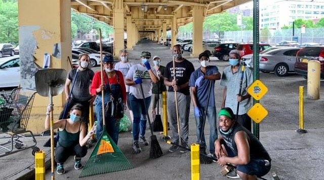 A crew of good samaritans cleaning up Fort Greene. Their group has met four times so far. Photo: Courtesy of Emese Ilyes.