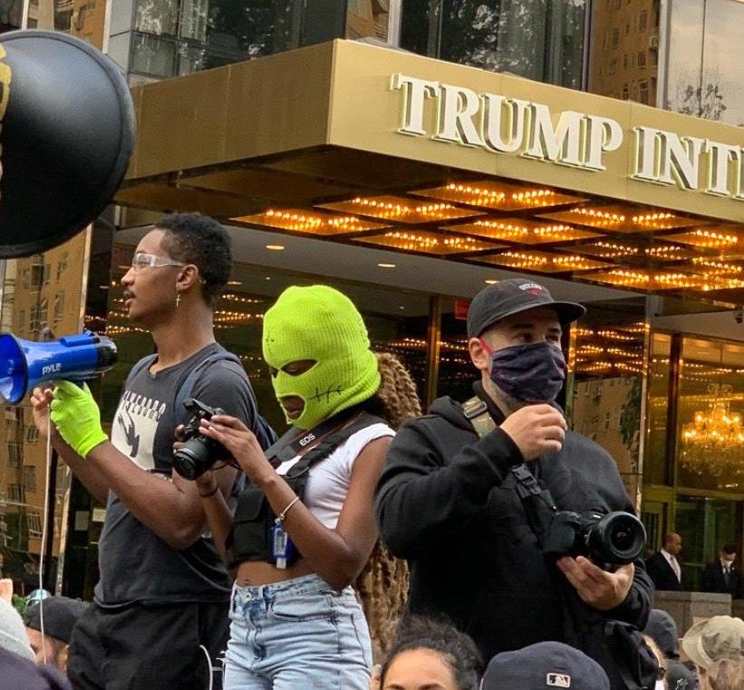 etia Jeune is yellow ski mask at Black Lives Matter protest in front of Trump Tower