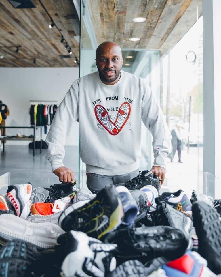 Andre McDonnell with donated shoes.  Photo: Supplied. 