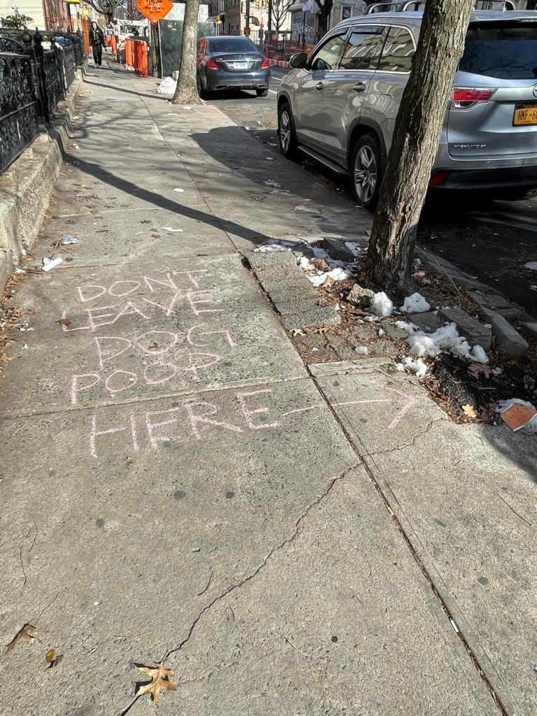 One of Kim's sidewalk signs. Photo: provided by Kathy Kim.