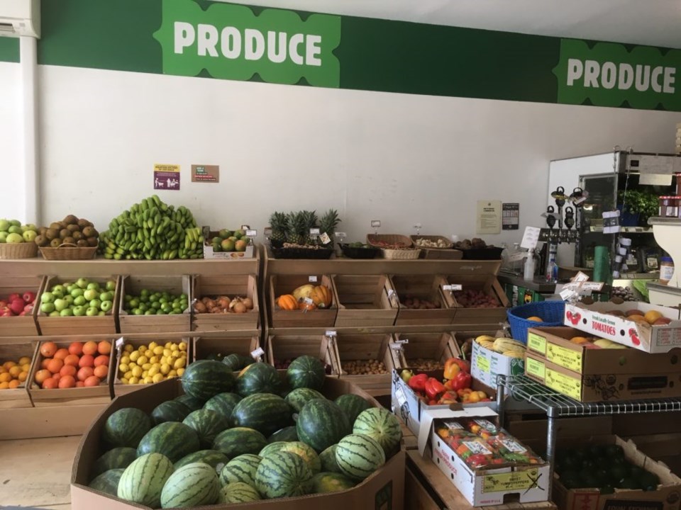 The produce aisle and self-serve kombucha station at Green Hill. Photo: Provided.