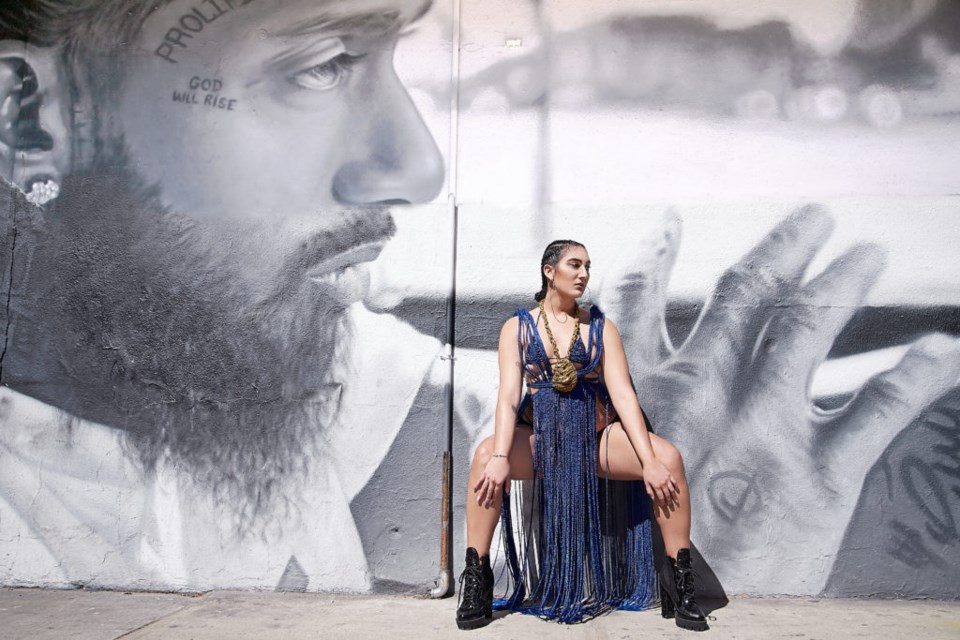 Model Veronica Rose in a wearable art piece made by Karyne Tinord in tribute to Nipsey Hustle. Photo by Woodline Dorcin.