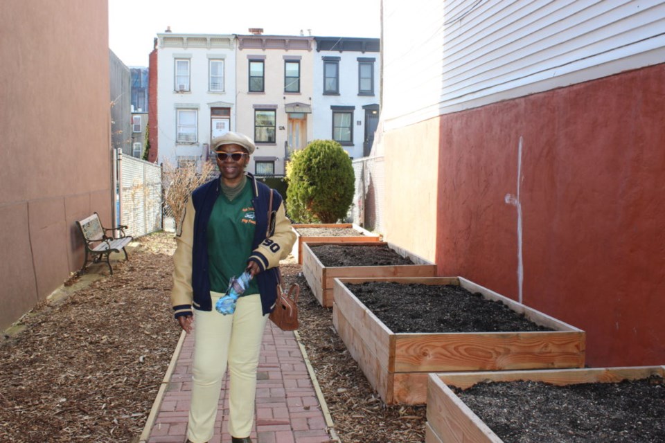 Davis and the new planter beds. Photo: Miranda Levingston for the BK Reader.
