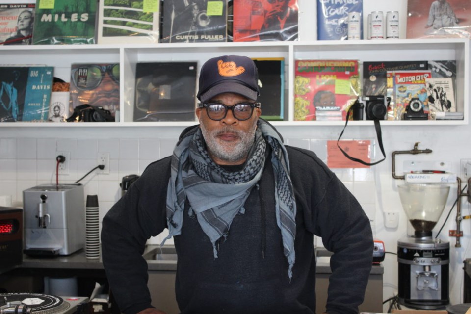 Martin Brewer behind the coffee counter. Photo: Miranda Levingston for the BK Reader.