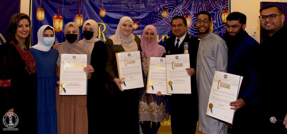 Leaders of local organizations holding their citations at the Iftar event on April 19, 2022.