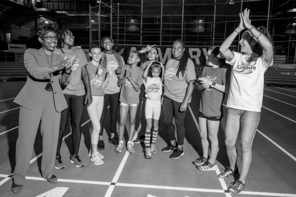 Cheryl Toussaint and her runners. Photo: provided by Colgate Palmolive. 