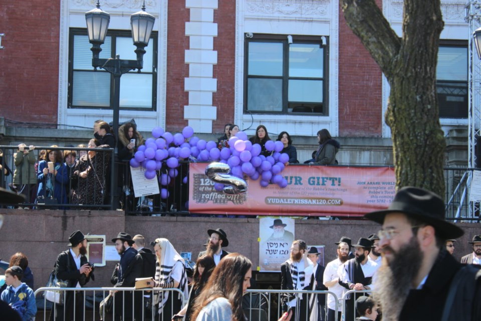 Merrymaking outside the Chabad World Headquarters in Crown Heights. Photo: Miranda Levingston for the BK Reader. 