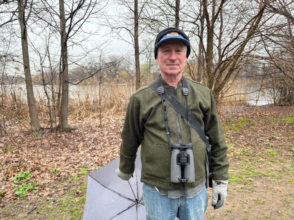 Robert Bate stands in Prospect Park