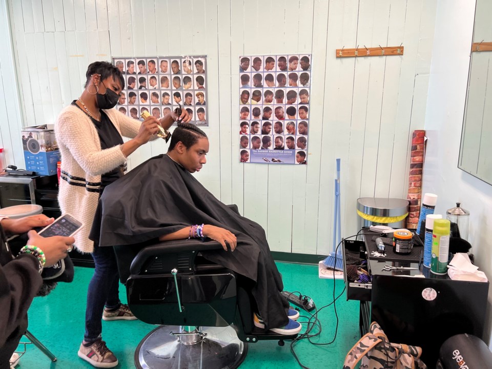 Young man getting a haircut at Bushwick Leaders High School on April 12, 2022.