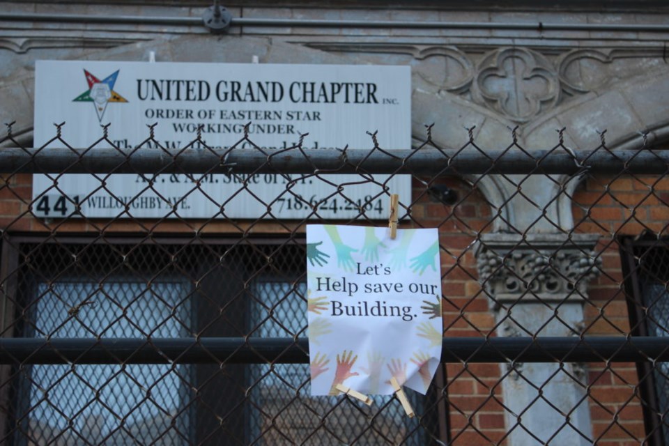 Signs in front of the Jacob Dangler house in April 2022. Photo: Miranda Levingston for the BK Reader. 