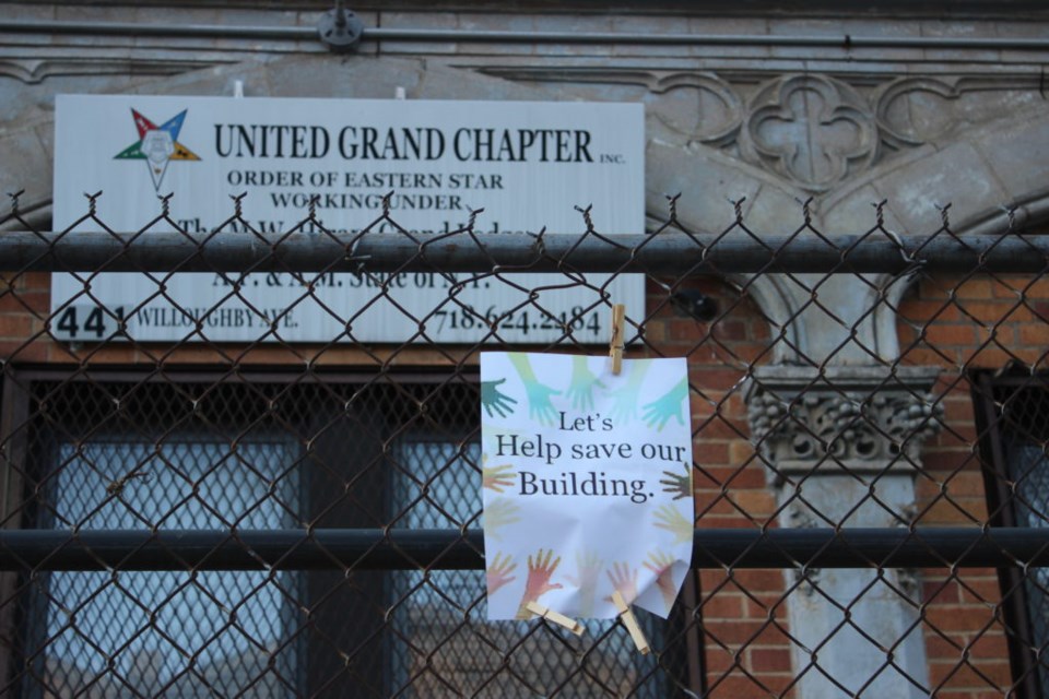 Signs in front of the Jacob Dangler house in April 2022. Photo: Miranda Levingston for the BK Reader.