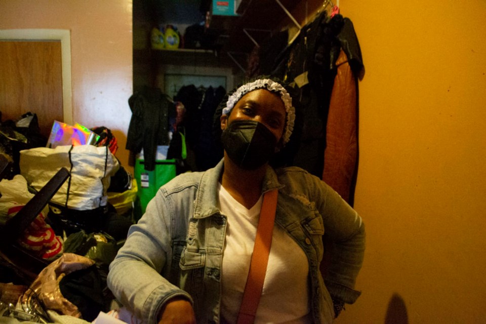 Ikorine Fairclough stands in her Brooklyn apartment