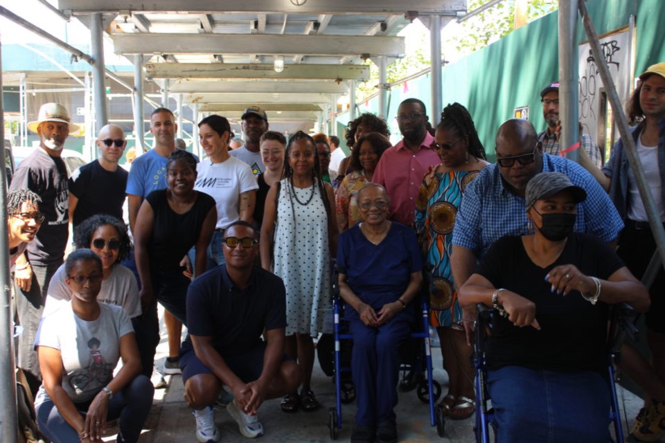 A group photo of the neighbors and electeds who are in favor of preserving the building. Photo: Miranda Levingston for the BK Reader.