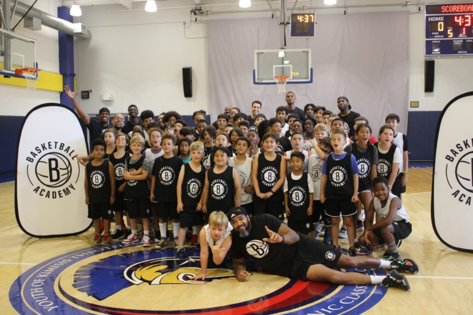 South Slope BNBA camp says cheese with Nic Claxton, who is in the center-back row. Photo: Miranda Levingston for the BK Reader.