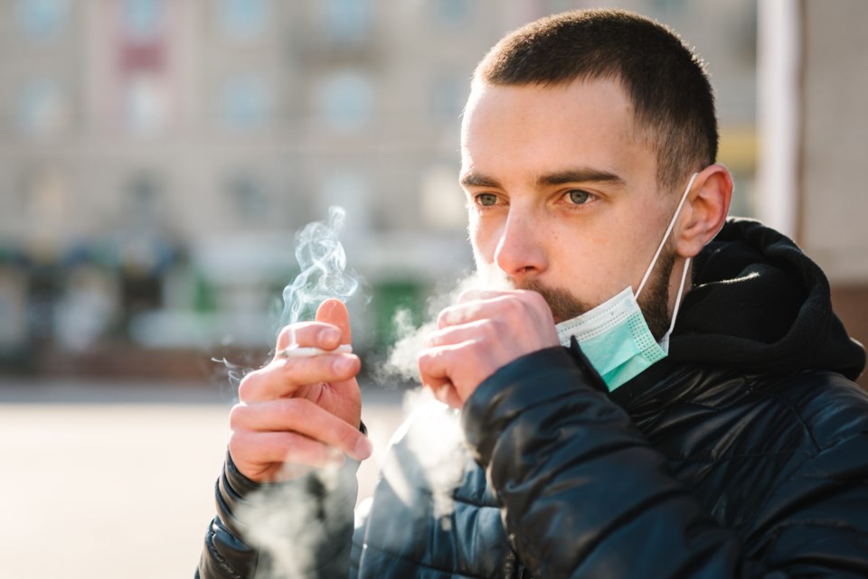 Smoking.,Closeup,Man,With,Mask,During,Covid-19,Pandemic,Coughing,And