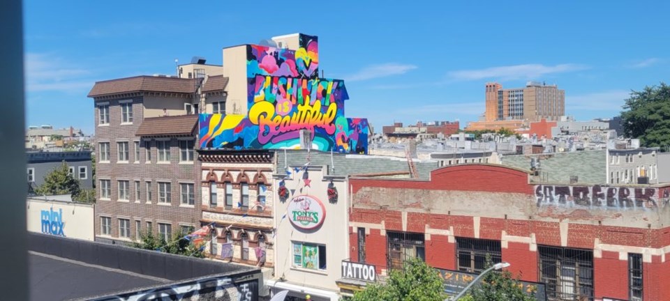 The Bushwick is Beautiful mural as seen from the Knickerbocker Avenue M train station