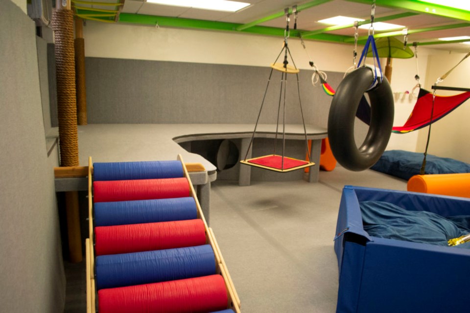 Swings and a rolling slide inside the Weeksville Gardens Children's Center's new sensory gym