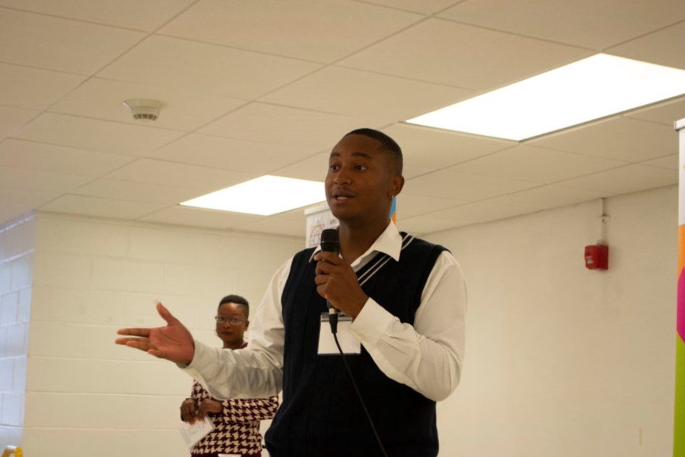 New York City Councilmember Chi Ossé speaks into a microphone