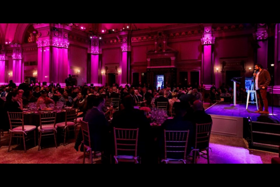 Brooklyn comedian Hari Kondabalu addresses the guests.