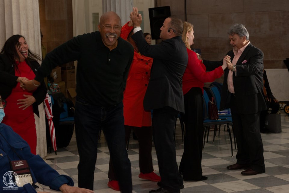 Brooklynites joyfully dancing to the music;