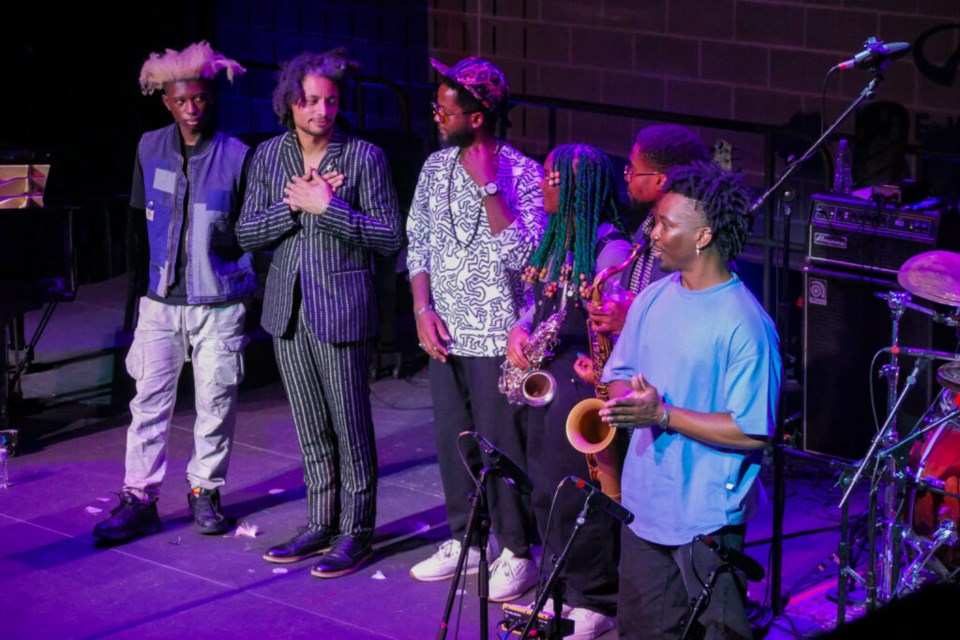 José James and his band absorb the audience's applause after performing an array of Erykah Badu's hits. Photo: Katey St. John for the BK Reader.