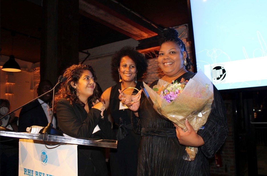 RHI gives award recipient Michel'le her flowers