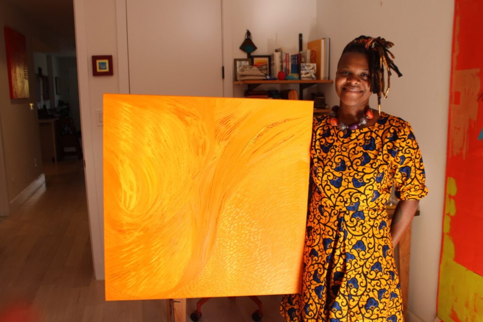 Shyvon Paul and one of her paintings. Photo: Christopher Edwards for the BK Reader. 