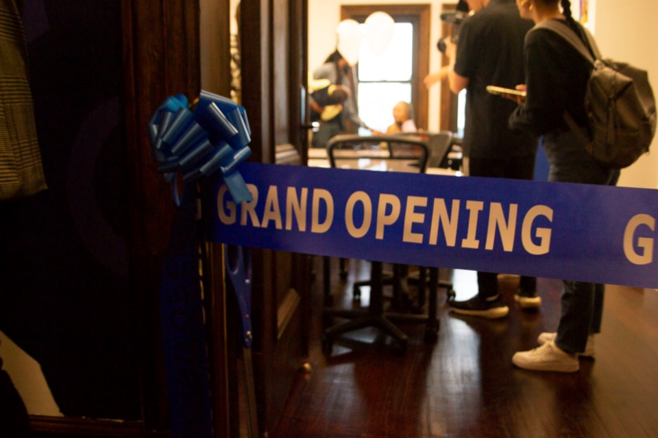 Digital Girl's new technology hub behind a grand opening ribbon. Photo: Will Fritz