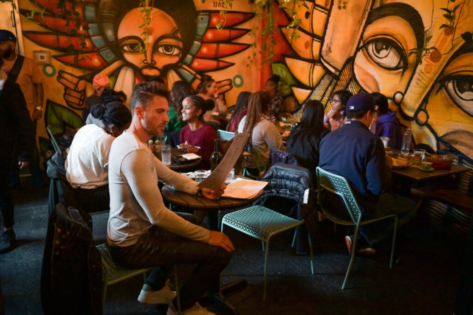 Groups and couples packed the space, which is covered in brightly-covered murals. Photo: Jonathan Mora for the BK Reader. 